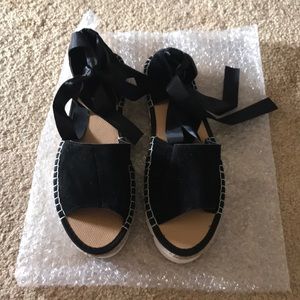 Never been worn black suede material with ribbon